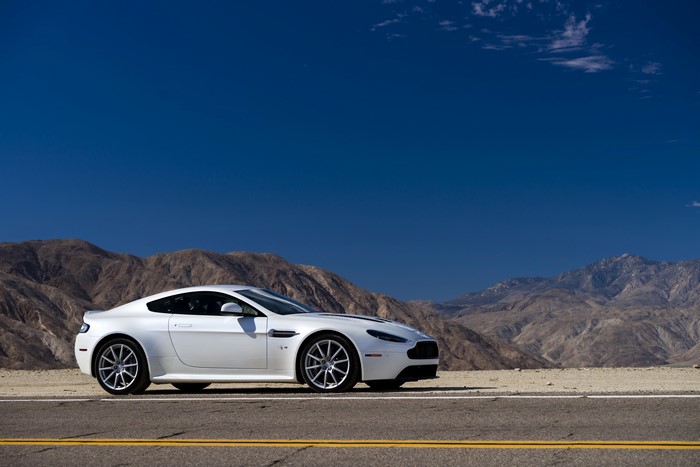 White Aston Martin 2013 V12 Vantage S on a desert road