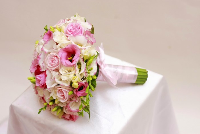 Pink and white rose and eustoma bouquet with pink ribbon
