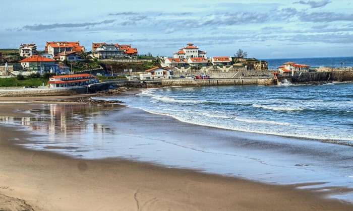 Beach and houses in Comillas, Cantabria, Spain