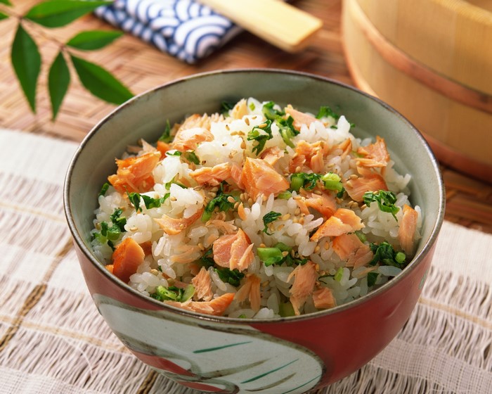 Bowl of rice with salmon and greens