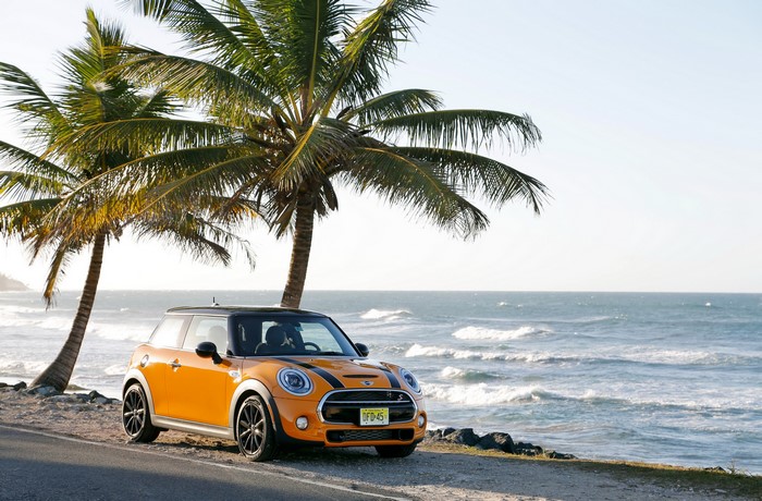Orange 2014 Mini Cooper S parked by the sea