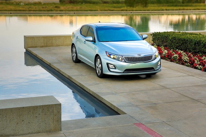 2014 Kia Optima Hybrid car by a water feature