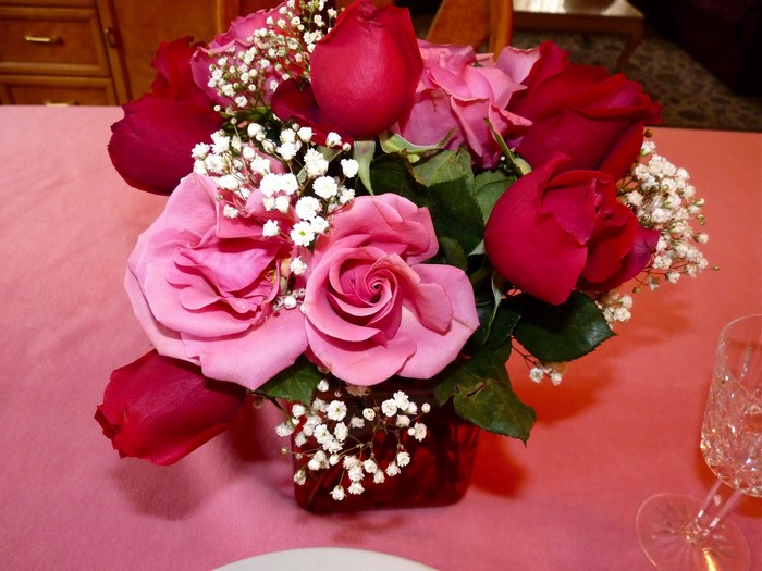 Bouquet of pink and red roses with baby's breath
