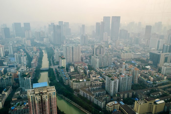 Aerial view of Chengdu, China with skyscrapers and a river