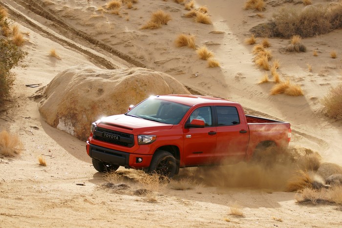 Red Toyota Tundra TRD driving in a desert