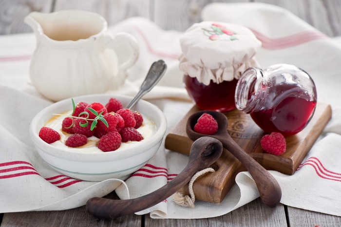 Raspberry jam and yogurt with fresh raspberries