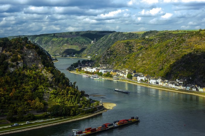 River valley with town and castle ruins