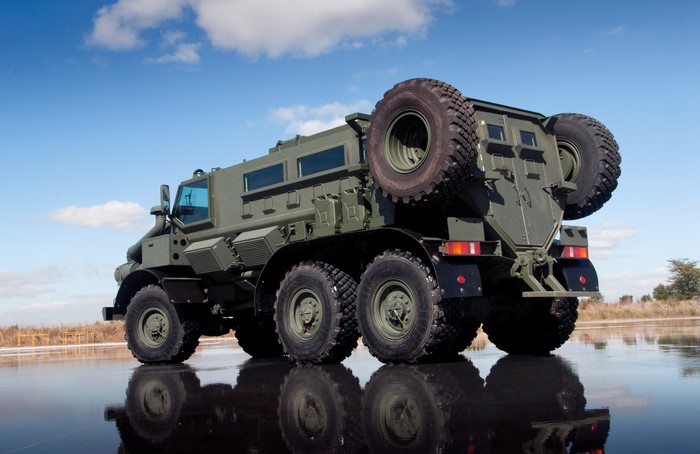 Casspir Mk6 military vehicle on reflective surface