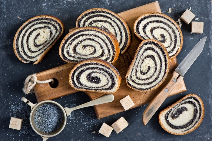 Poppy seed roll slices on a wooden board