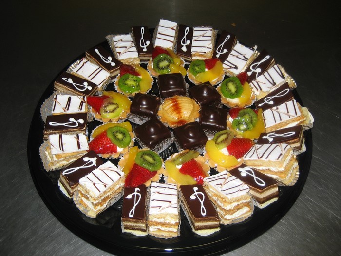 Assortment of small cakes and pastries on a platter