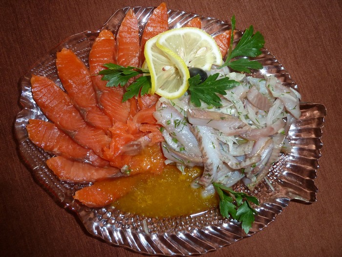Smoked salmon and herring platter with lemon