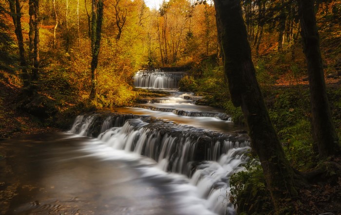 Waterfalls in an autumn forest in France
