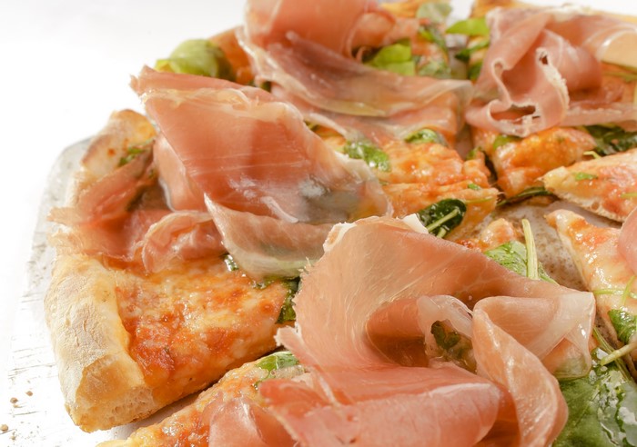 Pizza with prosciutto and arugula