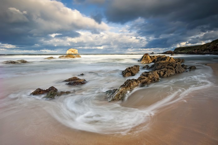 Long exposure of waves crashing on rocks at North Berwick, Scotland