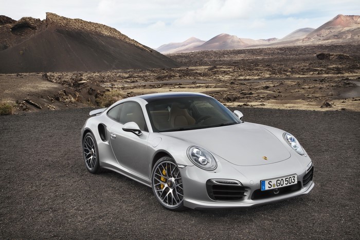Silver Porsche 911 Turbo S in a volcanic landscape