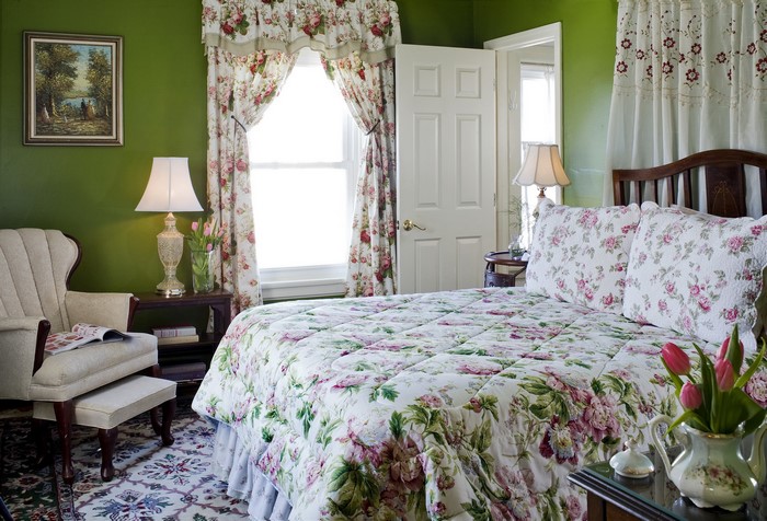 Bedroom with floral curtains and bedding