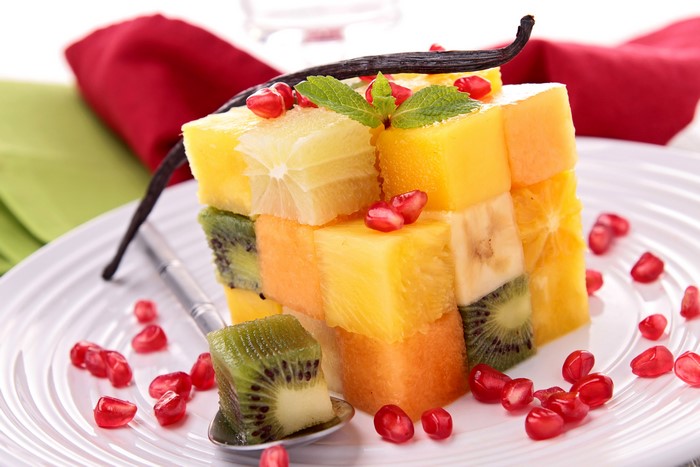 Fruit salad cube with kiwi, pineapple, and pomegranate