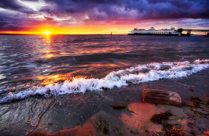 Sunset over the water with a ferry at Edmonds, Washington