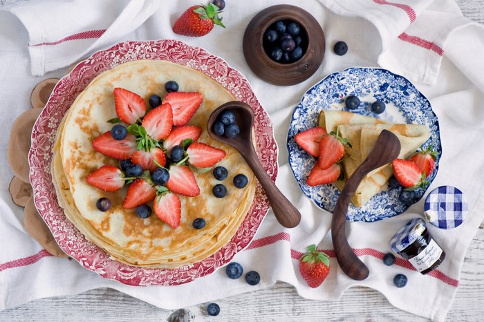 Pancakes with Strawberries and Blueberries on Plates