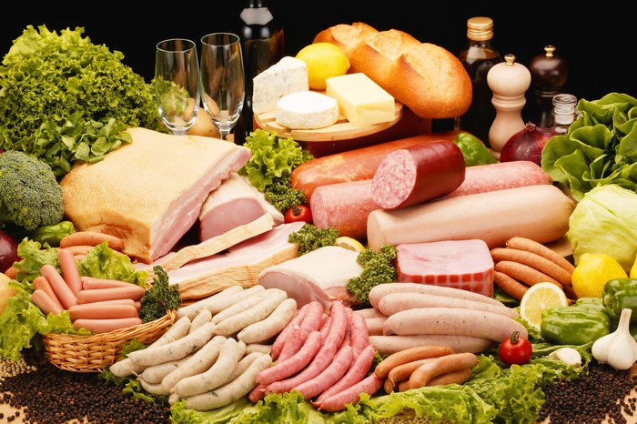 Assortment of Meat Products, Bread, Cheese, and Vegetables