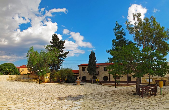 Courtyard with fountain and buildings in Maroni, Cyprus