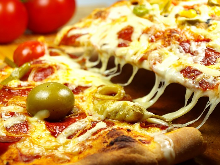 Pizza with melted cheese and toppings