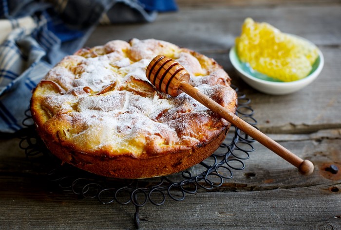 Apple pie with honey dipper and honeycomb
