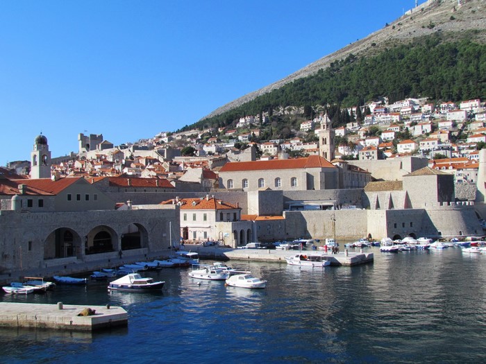 Dubrovnik, Croatia harbor with old city and hill