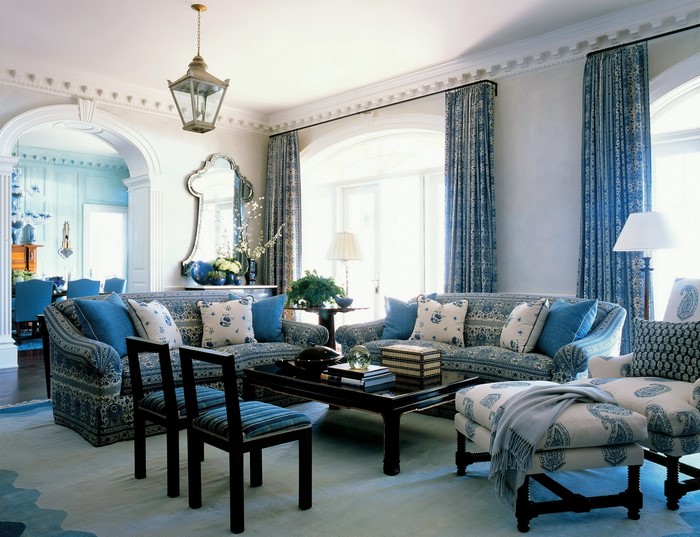 Living room with blue and white patterned sofa and chairs