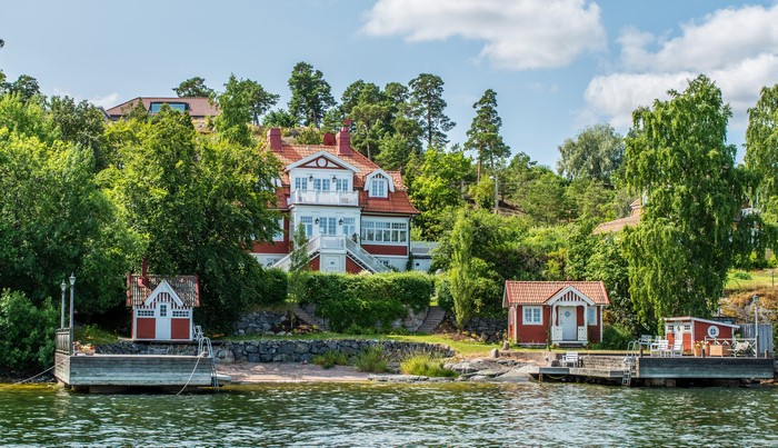 Houses on a hill overlooking a body of water in Nacka, Sweden