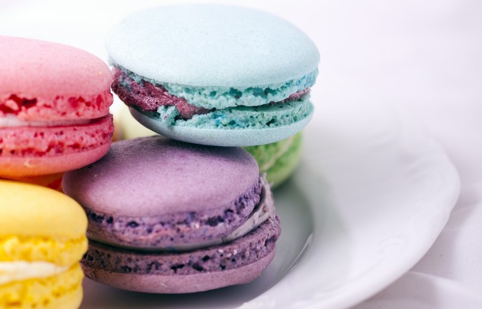 Colorful macarons on a white plate