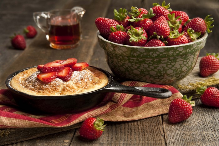 Dutch Baby Pancake with Strawberries and Syrup