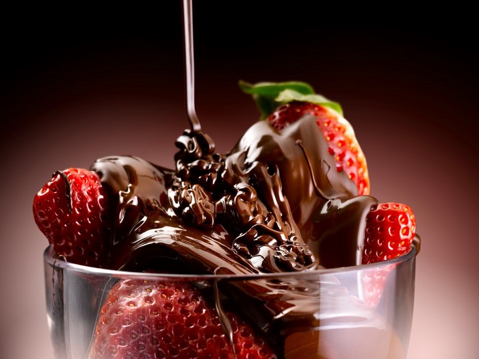 Strawberries with chocolate sauce in a glass