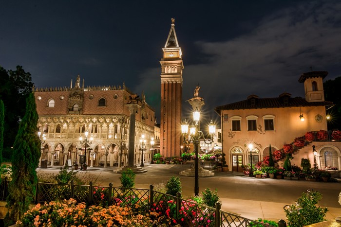 Night view of Italian-themed architecture with a clock tower