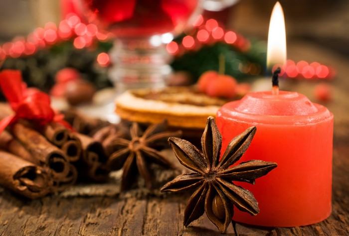 Christmas still life with candle and spices