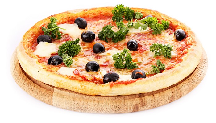 Pizza with olives and parsley on a wooden board