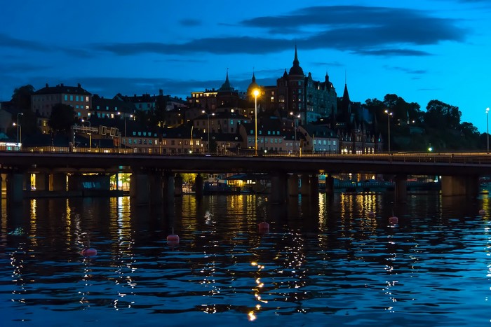Stockholm cityscape at night with bridge and river
