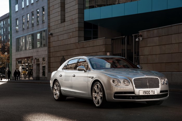 Silver Bentley Flying Spur V8 parked on city street