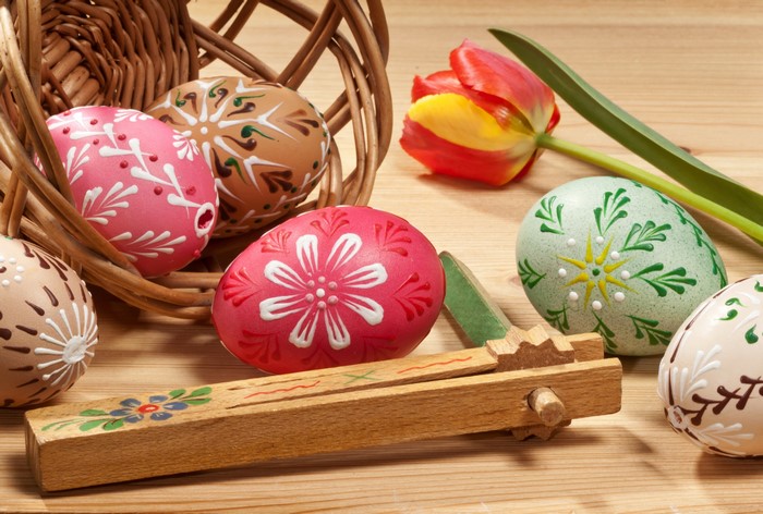 Easter Eggs in a Basket with a Tulip and Rattle