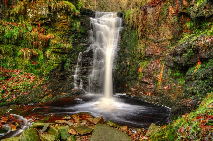 Waterfall cascading over mossy rocks in Anglezarke, England