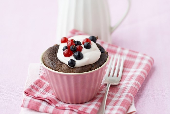 Chocolate cupcake with cream and berries