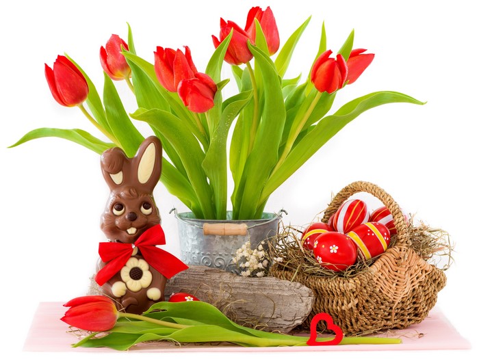 Easter still life with chocolate bunny, tulips, and eggs