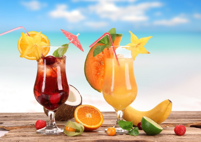 Tropical Cocktails with Fruits on a Beach