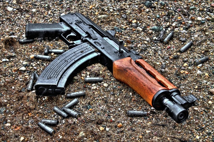 AK-47 assault rifle with spent cartridges on the ground