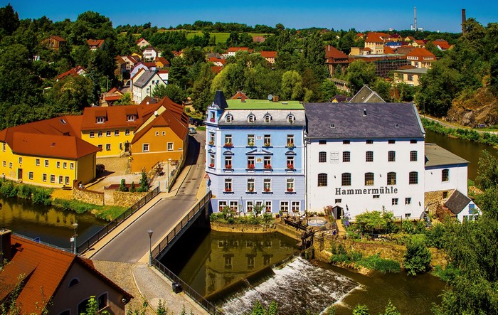 Hammermühle building and bridge over river in Bautzen, Germany
