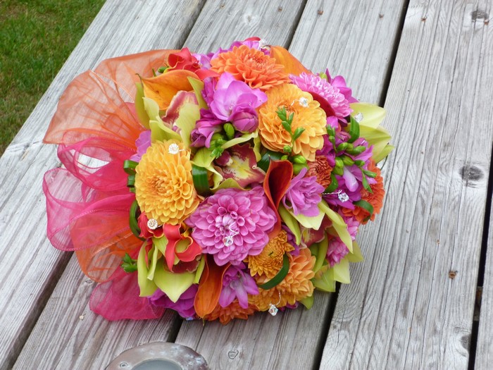 Colorful wedding bouquet with dahlias and orchids