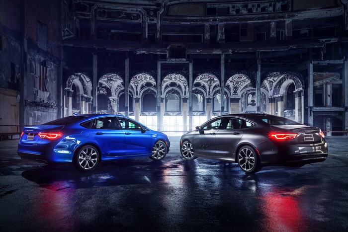 Two Chrysler 200 Sedans in a Dark, Ornate Building