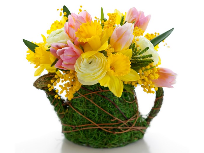 Spring flower arrangement in a watering can
