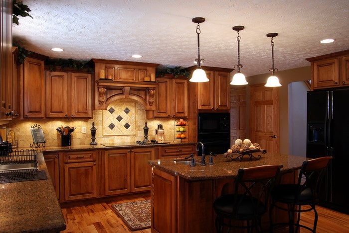 Kitchen with wooden cabinets and island