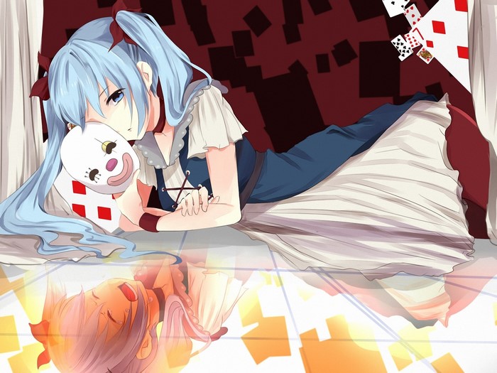 Girl with blue pigtails holding a clown mask